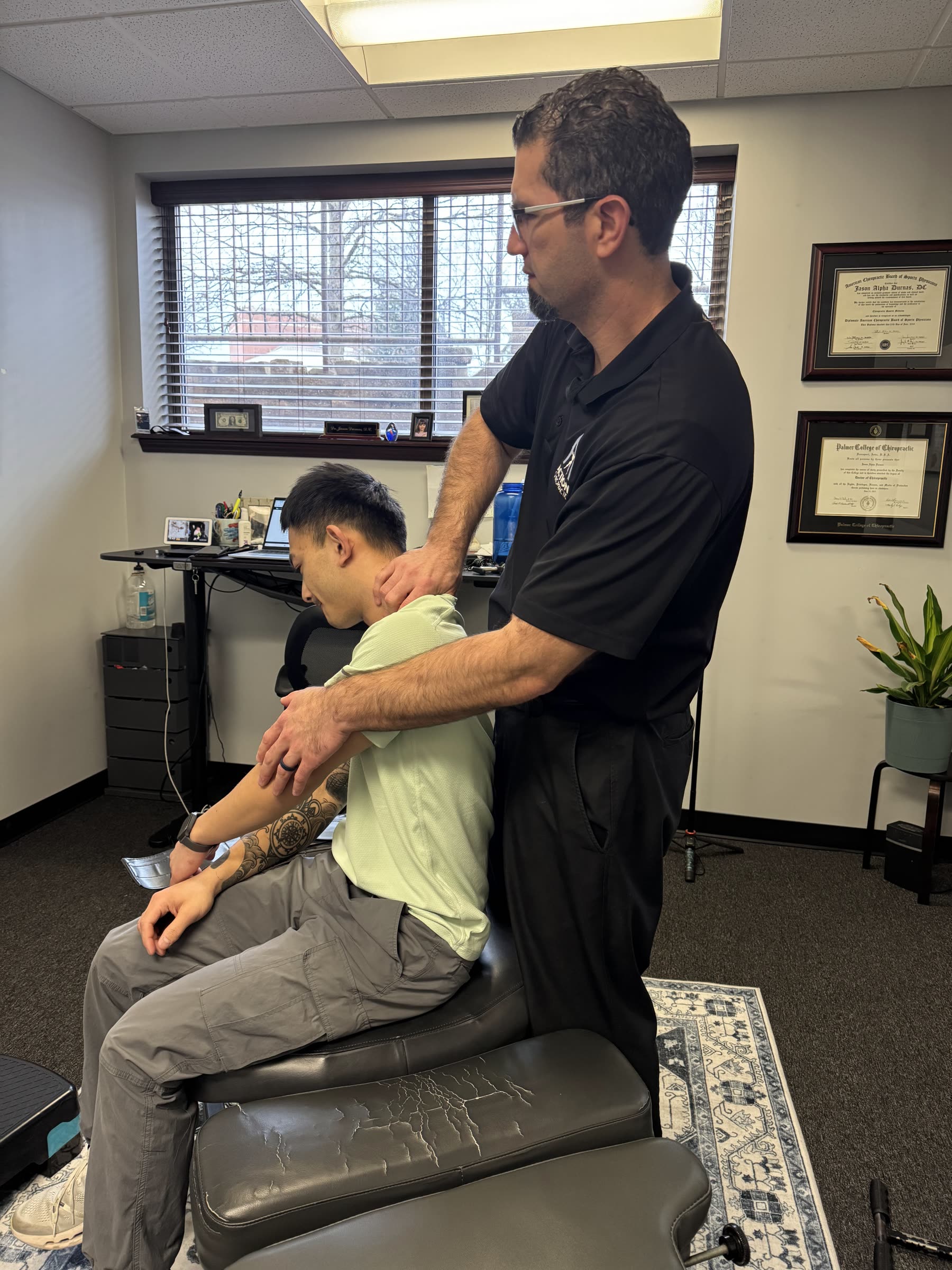 Dr. Durnas performing a seated adjustment