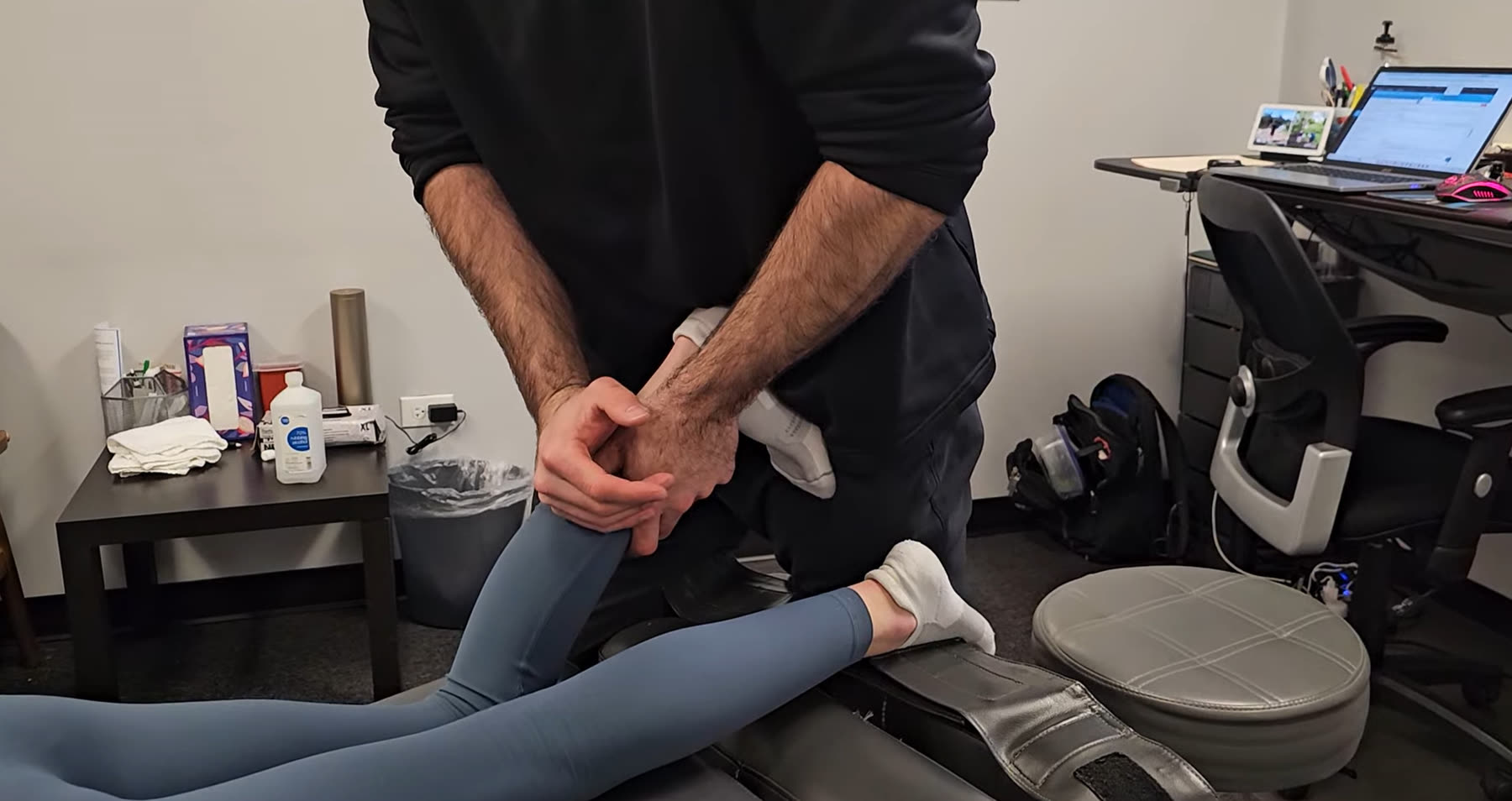 Dr. Durnas working through a patient's lower leg and ankle
